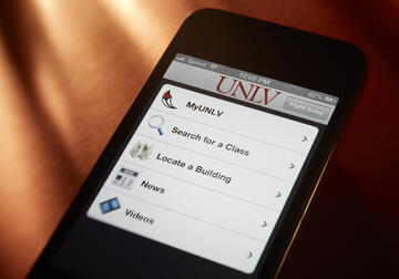 Photo of a smart phone with UNLV's app loaded on screen.