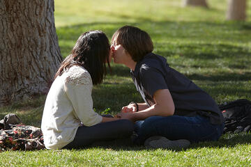 Students Jeffery Armst and Sasha-Anne Ditchen share a kiss.