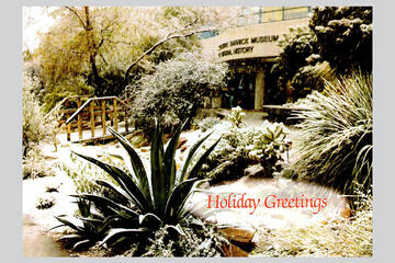 Holiday graphics card containing a beautiful shot of campus snowed over.