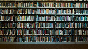 Several bookshelves filled with books in a library setting