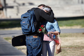 Steven Scamorza says goodbye to his girlfriend, Nicole Pagliero, before heading to class.
