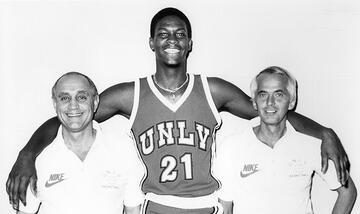 Tarkanian with Sidney Green (1979-83) and an unidentified athletics staff member. Green's jersey was the first to be retired at UNLV.