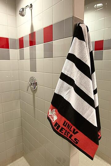 The showerheads were raised to accommodate players like the 6-foot-10-inch Brice Massamba.