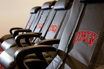 Oversized chairs in the film room accommodate the build of UNLV’s coaches and players.