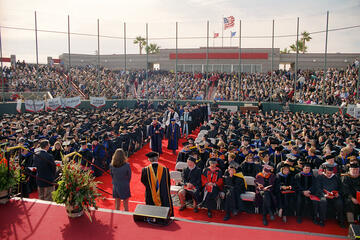 Graduates take the field at Wilson Baseball Stadium