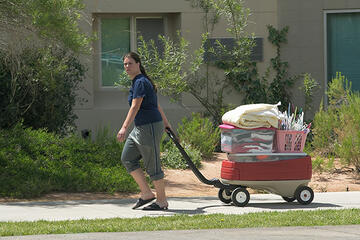 A student wheels in the necessities for her dorm in 2004, the same year Dayton Complex opened. (Aaron Mayes/UNLV Photo Services)