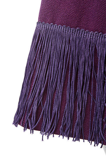 Detailed view of the end of koolat pants containing fringe.