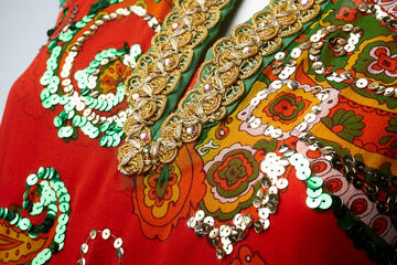 Close up view of a dashiki styled shirt's collar.