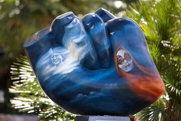 Close up view of a colorful heart sculpture on campus.