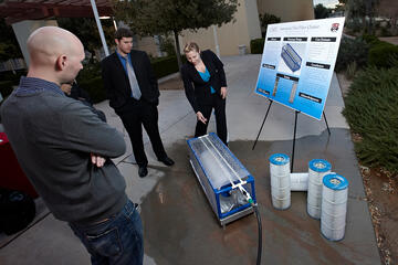 Water Bender-The Automatic Pool Filter Cleaner: The user-friendly, affordable device cleans pool filters while saving water. Currently, pool owners have to clean their pool filters by hand, which is messy and wasteful. The pool owner connects the device to a standard garden hose, attaches the filter on a roller axle, and opens the spray valve. The Water Bender uses high-pressure jets of water to remove dirt from each fold. Team members: Michael Baird, Shelby E. Nelson and Praveen Raj.