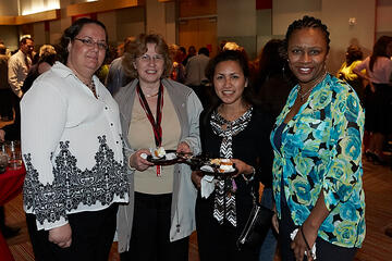 UNLV employees posing at holiday reception.
