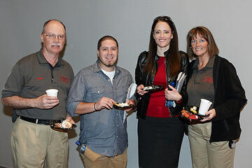 UNLV employees posing at holiday reception.