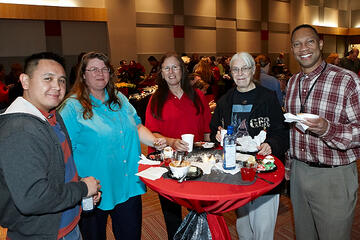 UNLV employees posing at holiday reception.