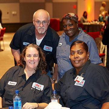 UNLV employees posing at holiday reception.