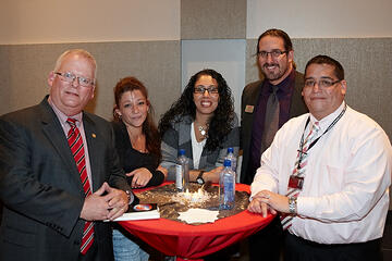 UNLV employees posing at holiday reception.