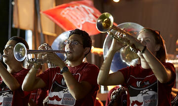 Two UNLV band players playing the trumpet.