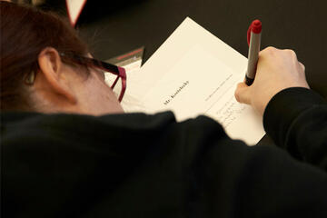 An overhead photo of a student doing an exam.