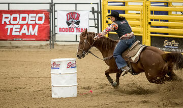 Tyla Treasure, a female member of the UNLV Rodeo Team, rides during a competition.
