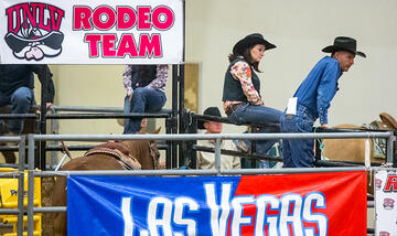 Members of the UNLV Rodeo team watching a rodeo event.