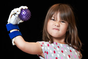 UNLV Engineering students have 4-year-old Hailey Dawson wearing Robohand