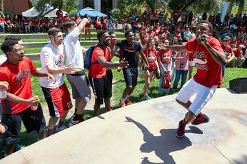 UNLV Honors student and rapper Tre Norman entertains members of the UNLV Men's Basketball team during the President's Barbecue, Friday. (Aaron Mayes/UNLV Photo Services)