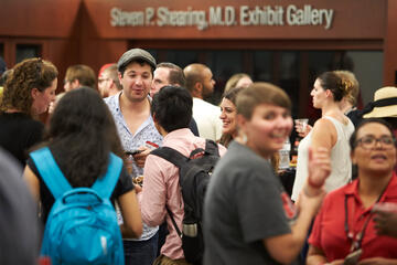 Graduate students enjoy a welcome event in the Goldfield room of Lied Library on Friday. New degree programs this fall include&nbsp;the nation's first master's degree in gaming law and regulation&nbsp;and doctoral programs in medical physics, interdisciplinary health sciences, and criminology and criminal justice.&nbsp;(Aaron Mayes/UNLV Photo Services)