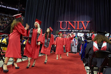 UNLV students celebrating during graduation ceremony.