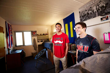 Freshmen kinesiology student Kleine Hao, left, and Jordan Ruiz go for flag-centric decor at Williams, Hao with his Hawaii banner and Jordan, in journalism and media studies, with one for the Human Rights Campaign.