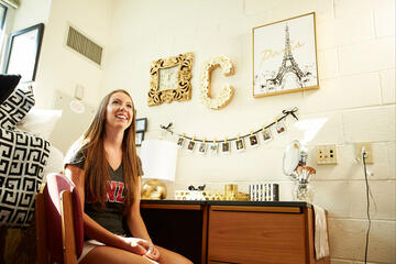 Carly Quintana hasn't been to Paris yet, but the biology major digs the look and it keeps everything on-point for the freshman's black, white and gold themed living space in Dayton South.