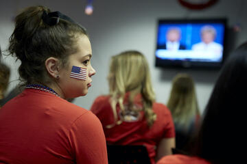 A student attends a watch party
