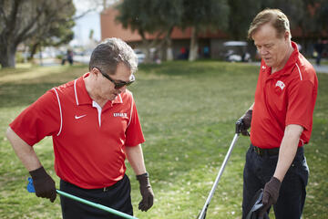 President Len Jessup and Chief of Staff Fred Tredup clean up the academic mall February 10 as part of the UNLV Beautification project. (Josh Hawkins/UNLV Creative Services)
