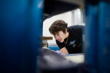 An art student works on lithography prints.