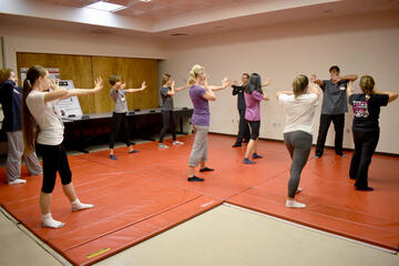 women taking self-defense course