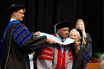 Student being honored during commencement.