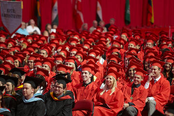 UNLV graduates sit while attending commencement.