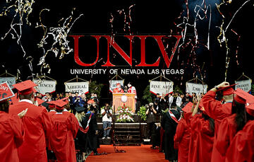 Confetti flies as students celebrate commencement's conclusion.