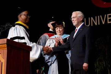 Student being honored during commencement.