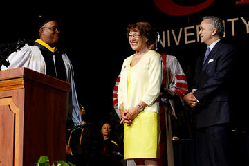 Attendee being honored during commencement.