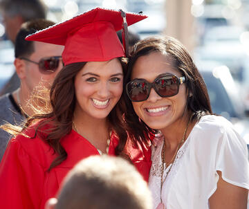 Students and family pose for camera.