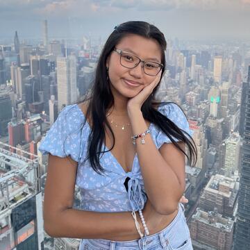 Caren Yap photographed with city background
