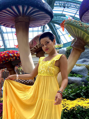 A woman stands in the Bellagio conservatory