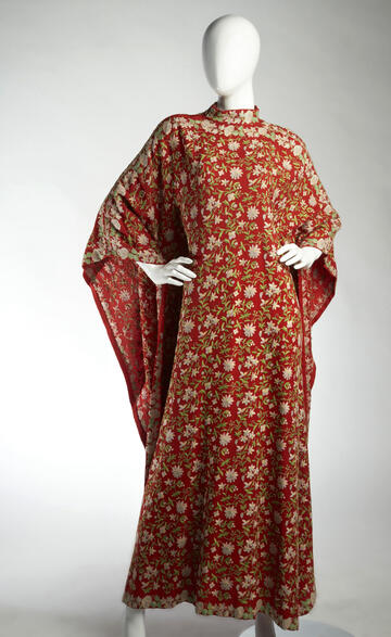 Since kimono-esque tea gowns became high fashion in the late-19th century, the “Orient” has proven a reliable inspiration for garments and textiles. Sidney’s first husband, Sands Hotel executive and Las Vegas legend Jack Entratter, purchased this hand-embroidered piece in the late 1960s; Mrs. Sidney still wears it today. The amalgamation of a Middle Eastern caftan with Asian floral motifs demonstrates the “hodge podge” aesthetics of Orientalism. (R. Marsh Starks/UNLV Photo Services)
