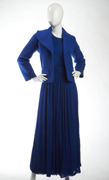 Sidney’s wardrobe documents not only changing aesthetics, but also the history of the American fashion industry. This bright blue wool jacket and dress was custom made for Mrs. Sidney by Miss Stella, the resident designer at I. Magnin. Considered the premier West Coast resident designer, Miss Stella was a driving force behind acceptance of California as a fashion tastemaker. Born in Lebanon, Stella learned to sew in French convents, worked as an apprentice in New York City and then Los Angeles, where she se