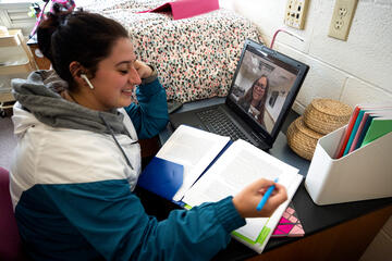 A student engages in a videoconference call
