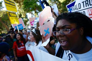 Protestors and media at the Presidential Debate.