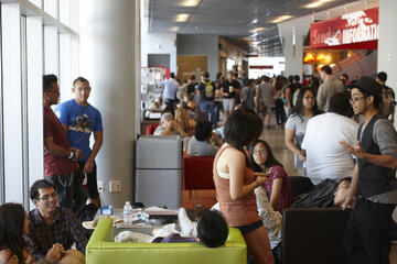 Students gathering and hanging out inside of the Student Union.
