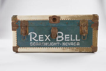 A steamer trunk marked "Rex Bell, Searchlight Nevada"