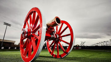 A red cannon on a field