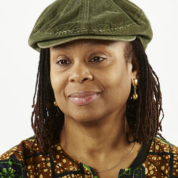 A woman wearing a green hat