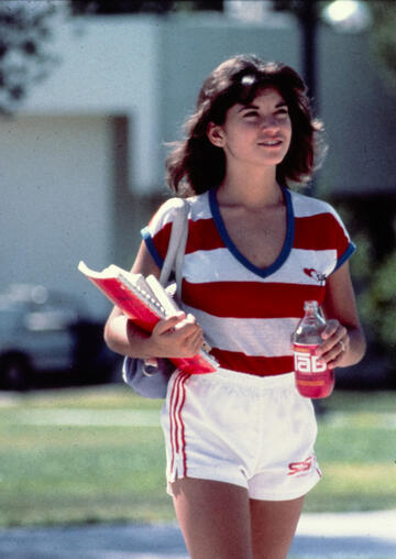 Female student in the 1970s holding tab cola